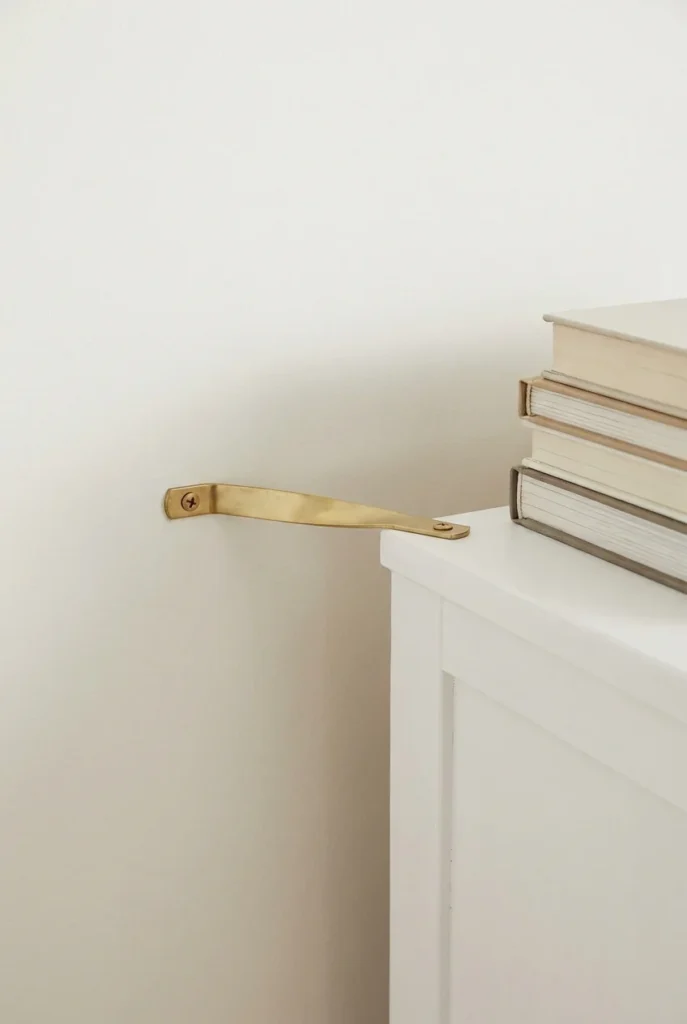 Anti-tip anchor strap securing a bookcase to a wall stud, a key step in reading nook bookcase wall safety.