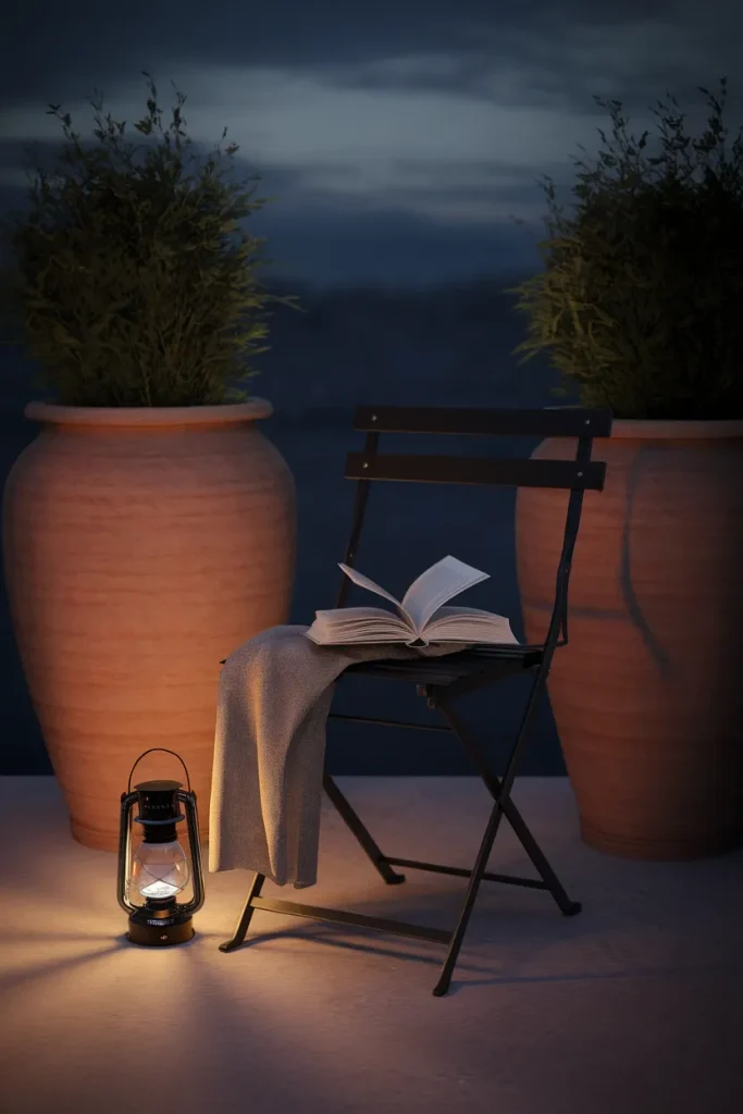 Bistro chair with a linen throw tucked between tall container garden pots under warm lantern light.