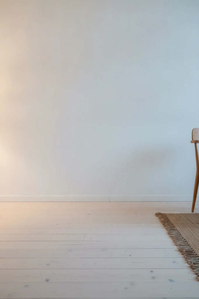 Deliberately empty corner in a cozy minimalist rental apartment.